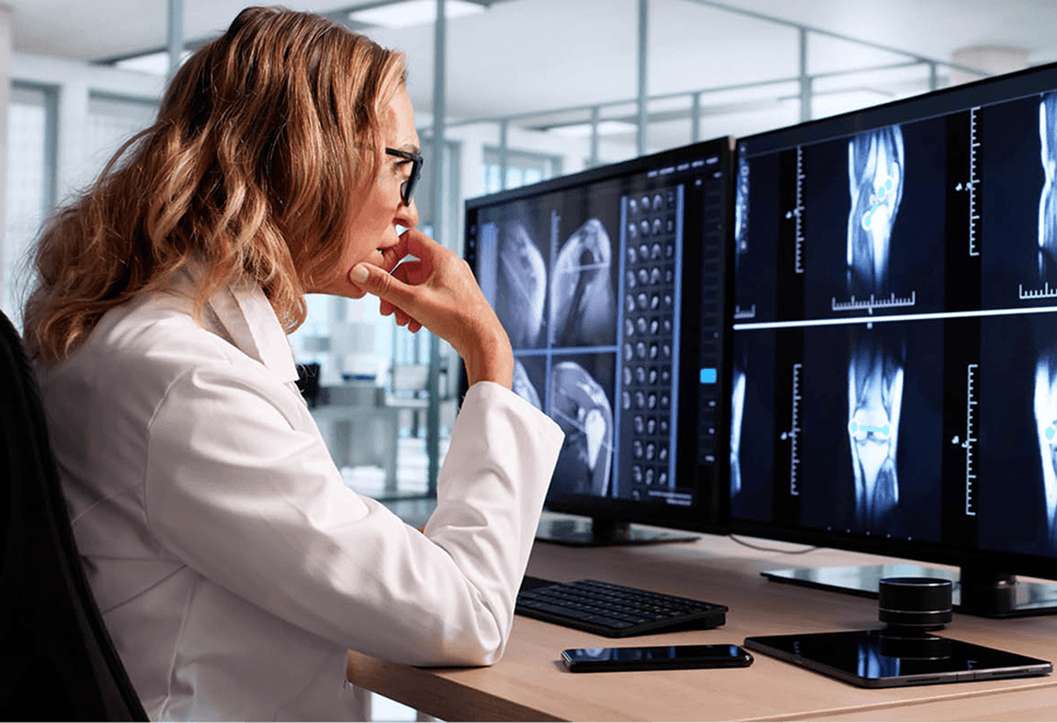 Radiologist reviewing medical imaging
